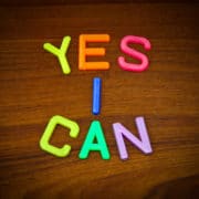 Yes I can in colorful toy letters on wood background